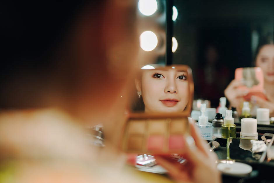 A woman applying makeup, captured in a mirror reflection surrounded by beauty pr